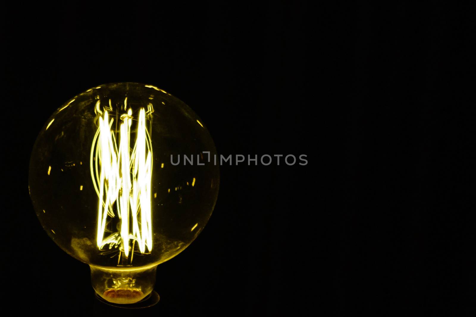 Close up light bulb on the black background