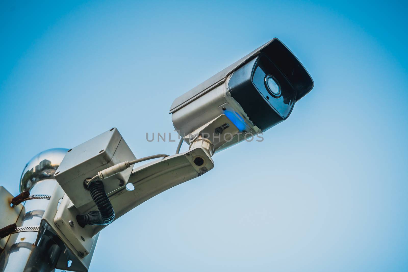 Outdoor security CCTV mornitor with blue sky background by psodaz