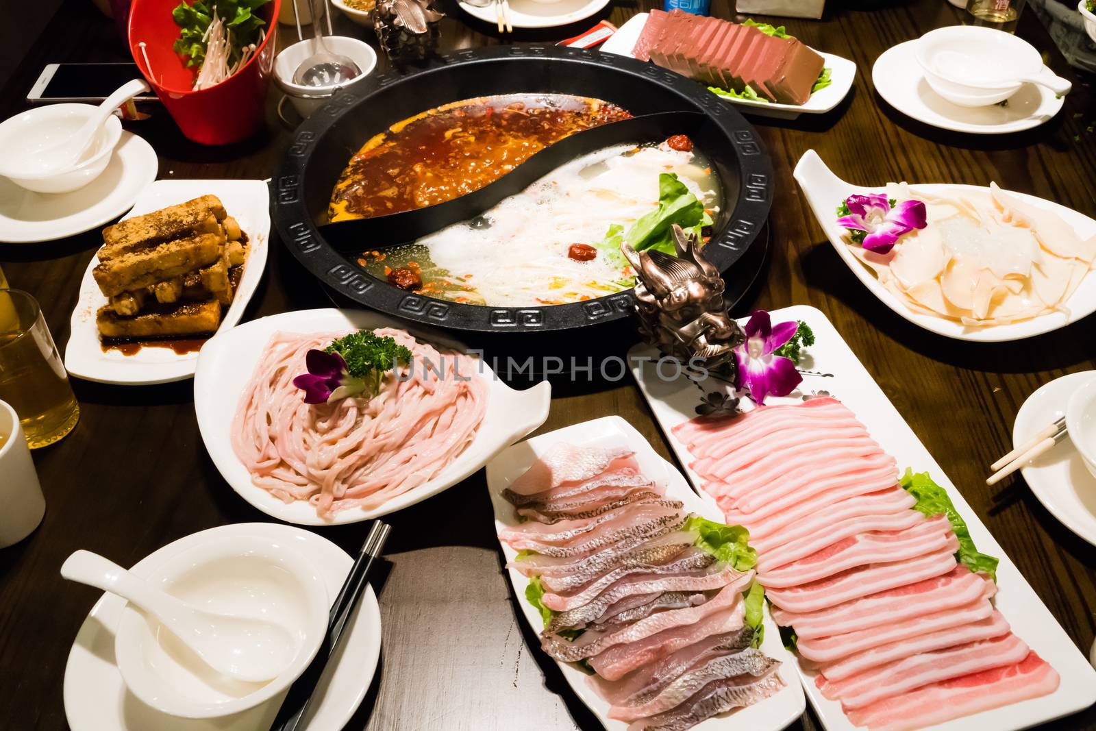 Shabu pot in Chinese style - pork soup and oily spicy soup