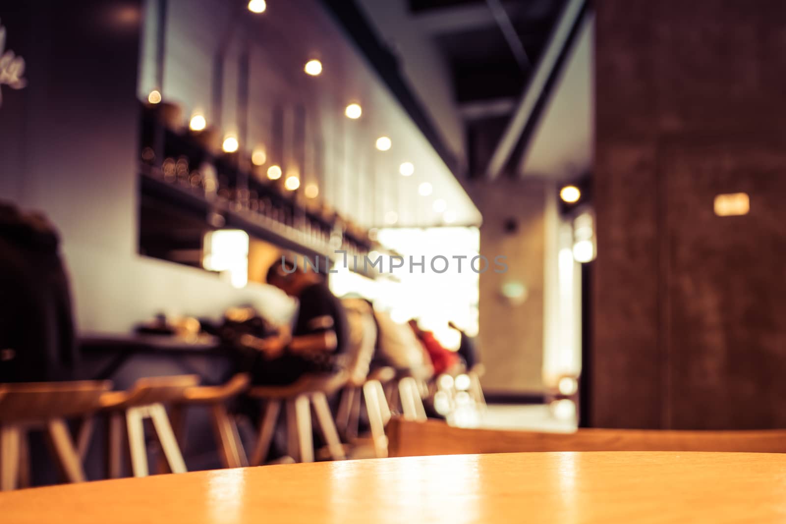 A cup of coffee - cafe blur background with warm tones