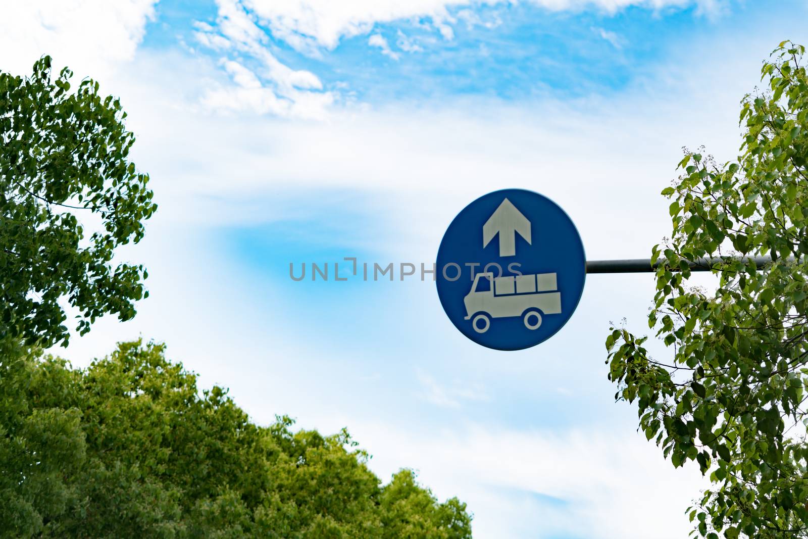 Truck entrance allowed sign on the blue sky and tree by psodaz
