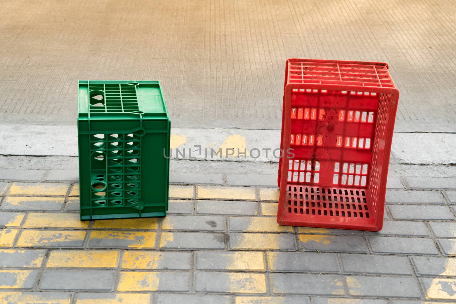 used red and green plastic box beside the road by psodaz