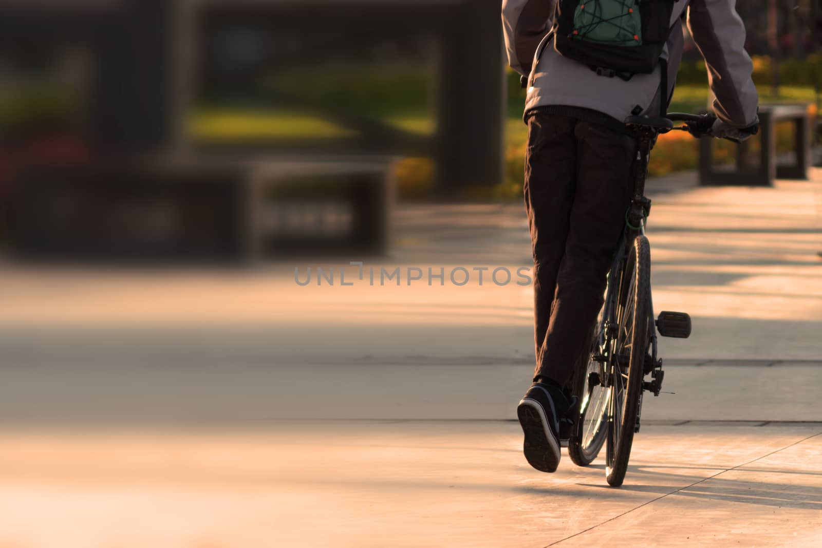 cyclist in a park by liwei12