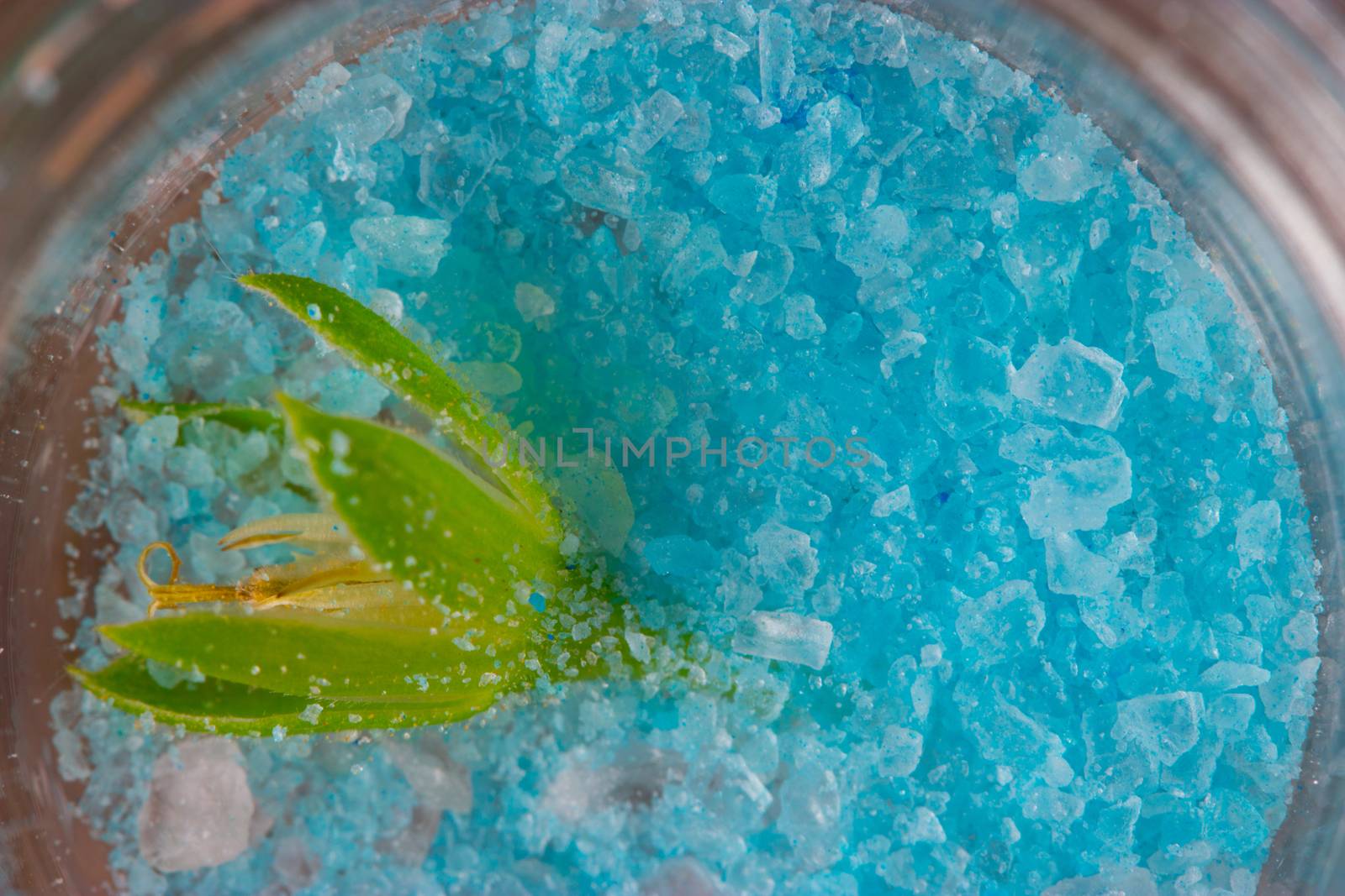 Spa blue sprinkled salt texture in a bottle