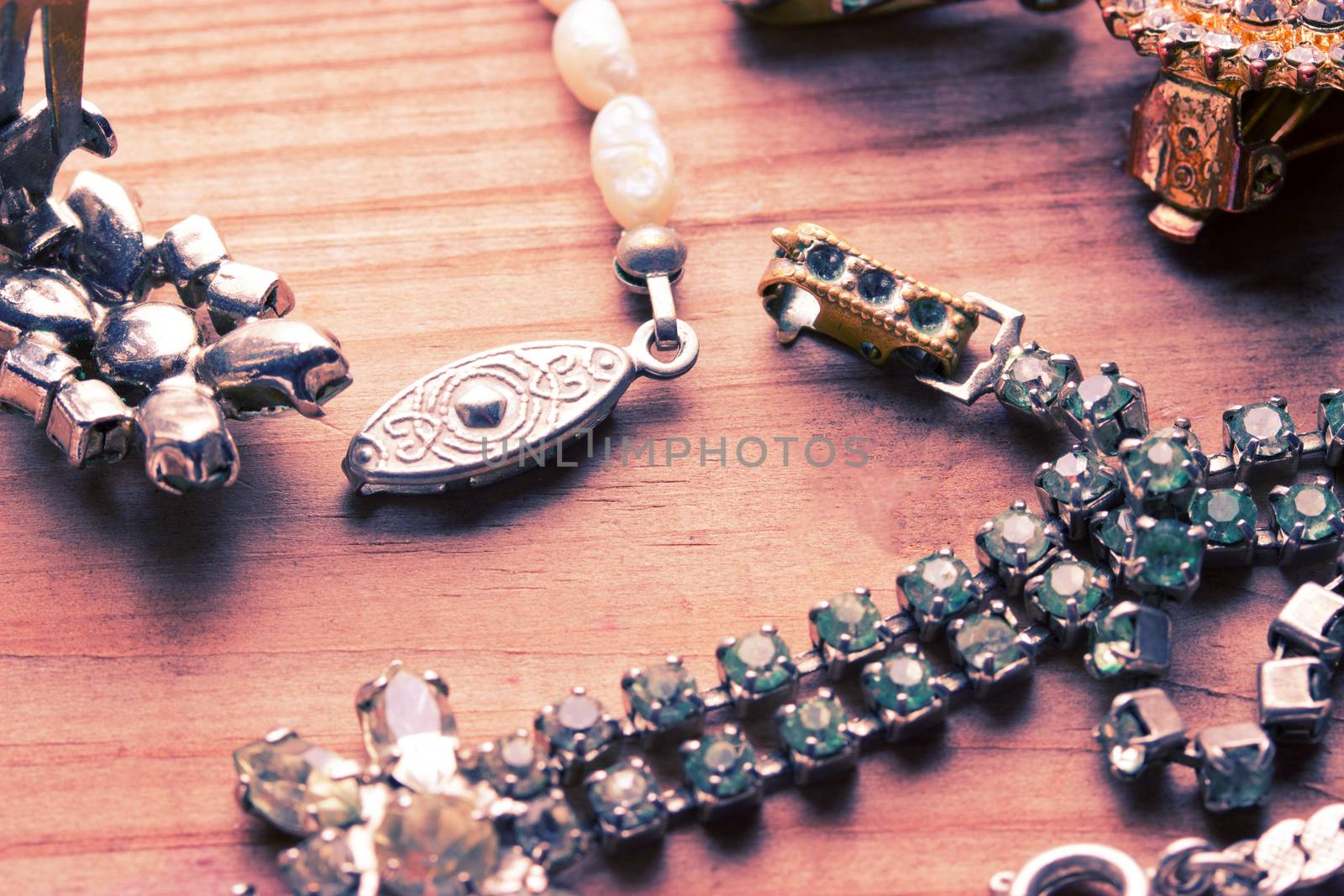 antique vintage silver jewellery on wooden table