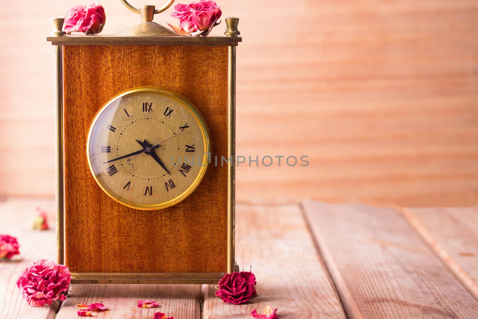 vintage style picture of an arrangement with a bouquet of roses, an clock