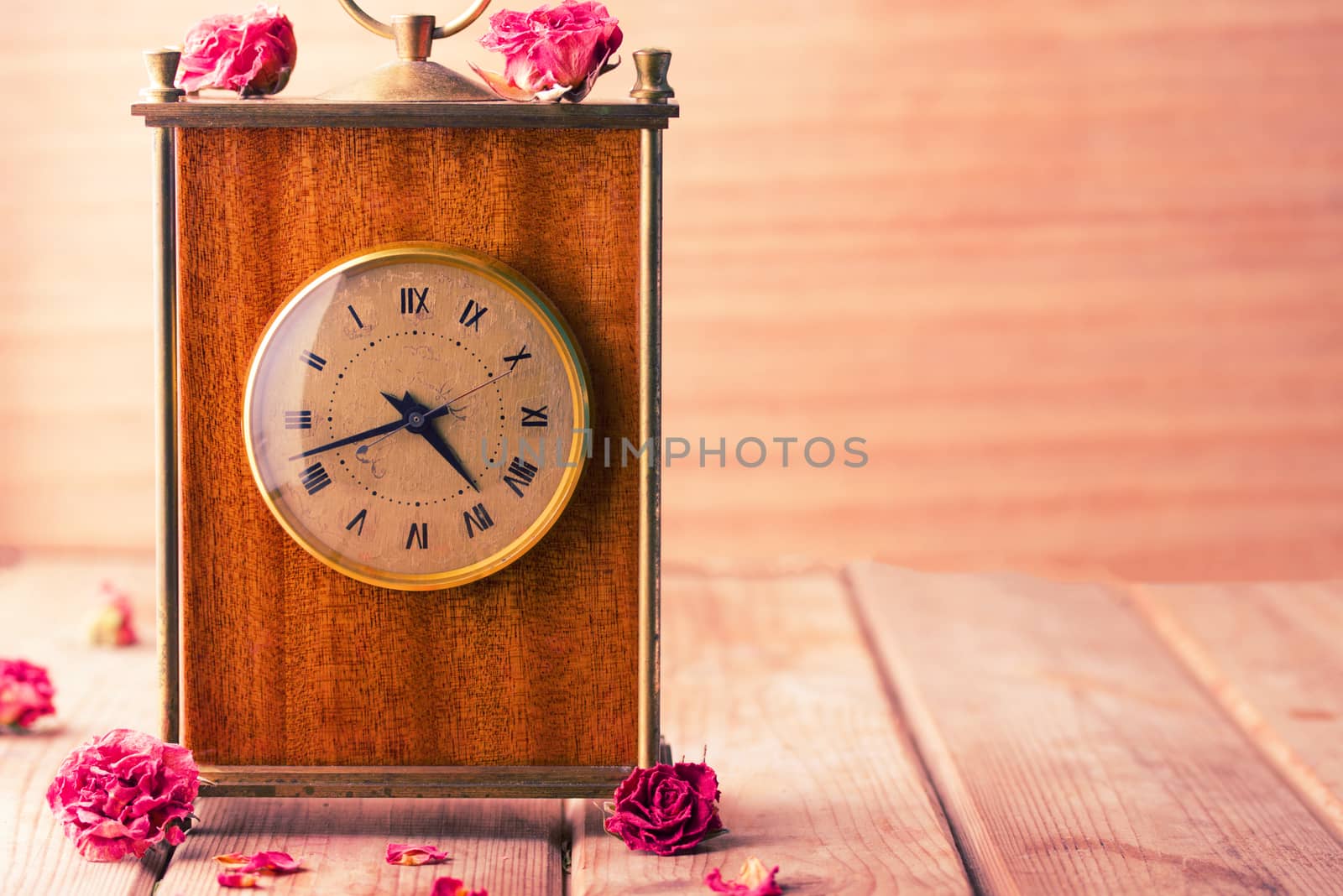 vintage style picture of an arrangement with a bouquet of roses, an clock