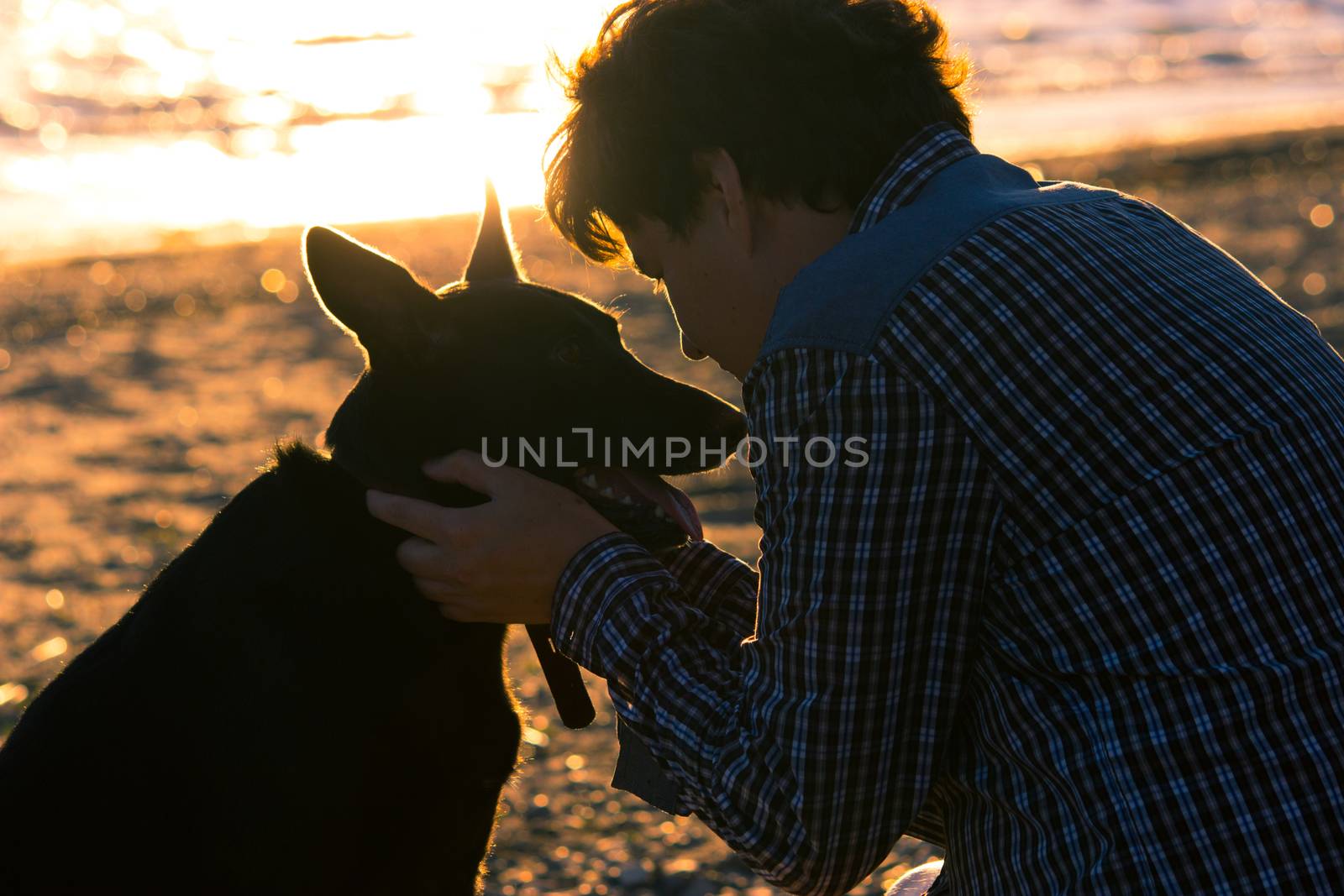 man and his dog on the beach by liwei12