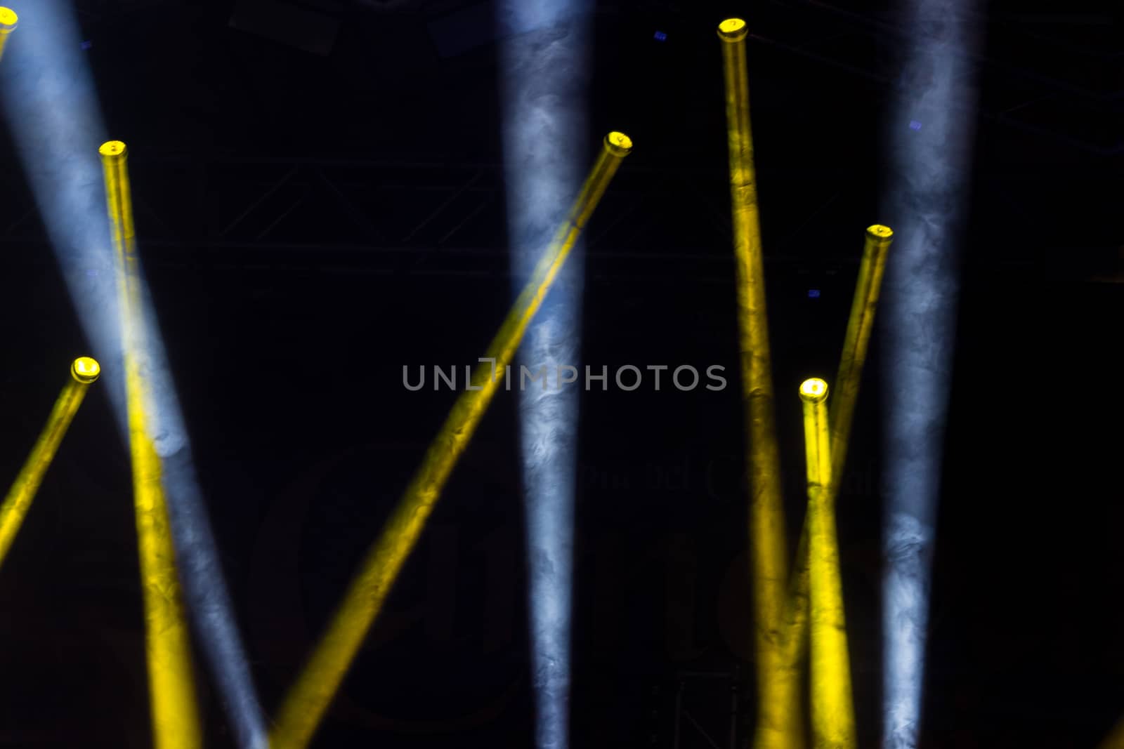 Colorful lights and smoke on a stage.