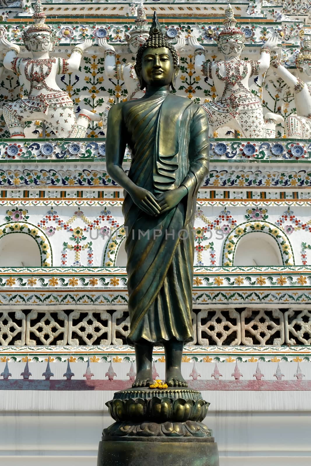 Ancient Bronze Buddha Image at Wat Arun Bangkok, Thailand. by mesamong