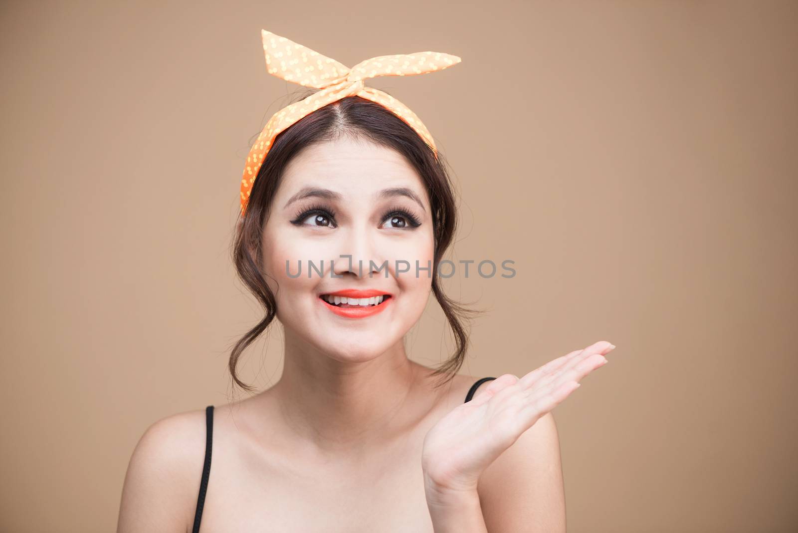 Surprised asian girl with pretty smile in pinup makeup style