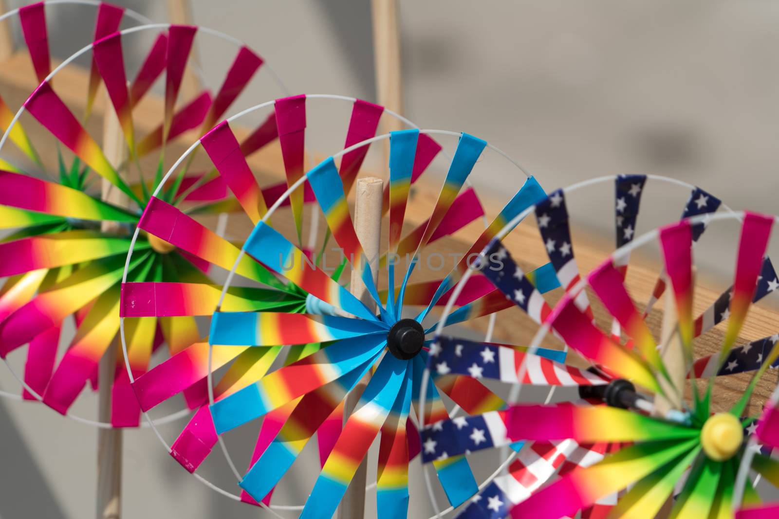 Close up the rainbow pinwheel toy, colorful turbines toy by psodaz