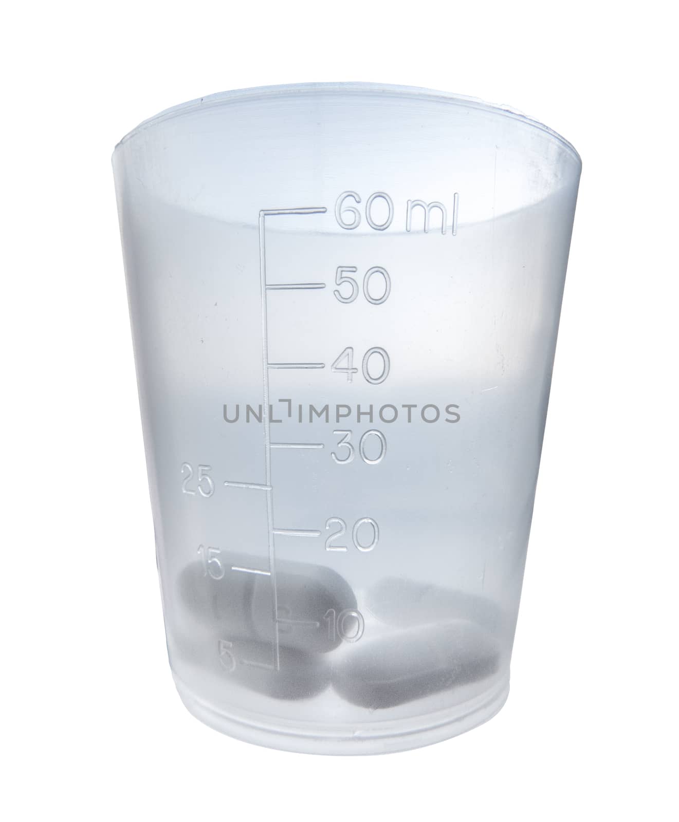 Isolated Medicine In A Plastic Medical Measuring Cup