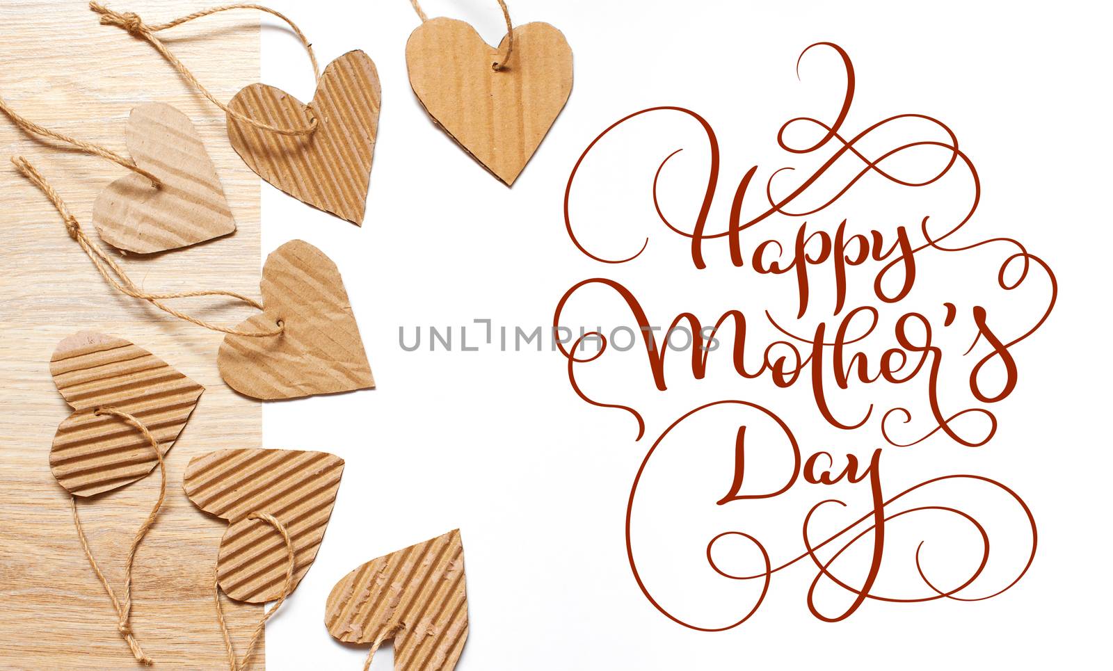 beautiful frame of hearts of kraft paper and text Happy mothers day. Calligraphy lettering hand draw by timonko