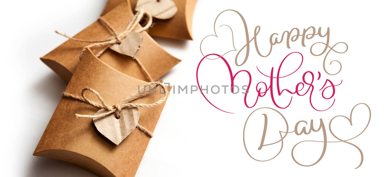 Beautiful boxes for gifts on a white background and text Happy mothers day. Calligraphy lettering hand draw by timonko