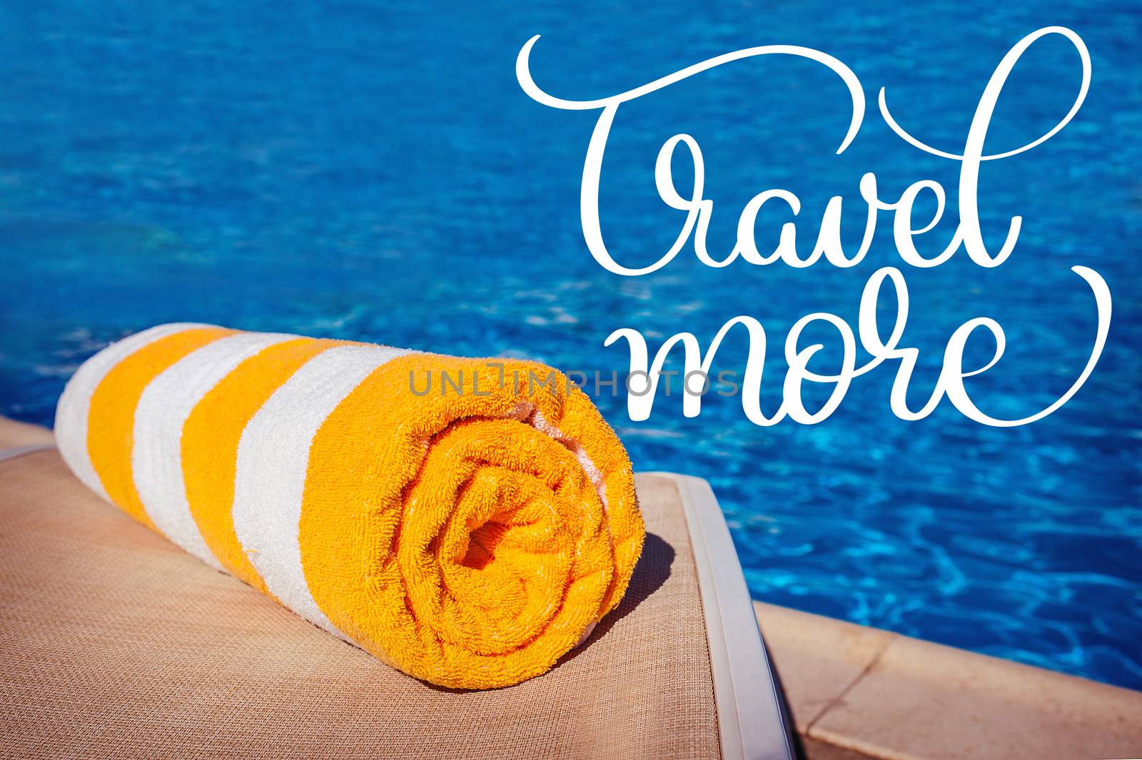 towel on a background of pool and text Travel more. Calligraphy lettering hand draw by timonko