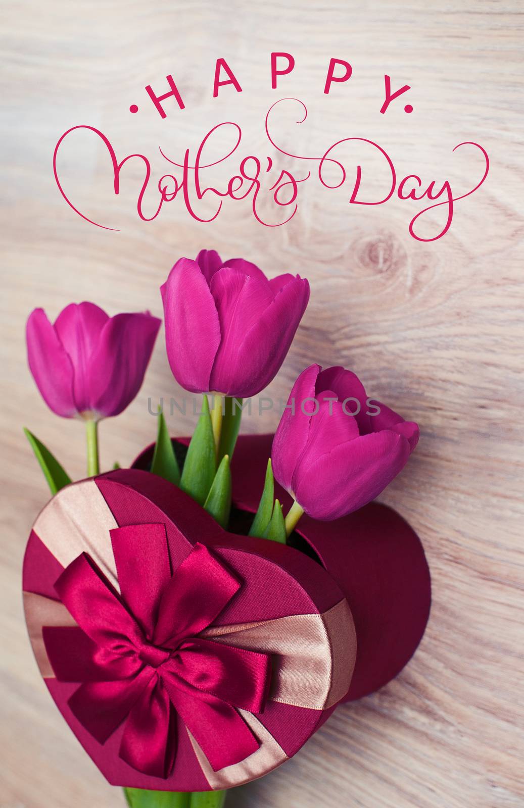 Three tulip in red gift box in form of heart and text Happy mothers day. Calligraphy lettering hand draw by timonko