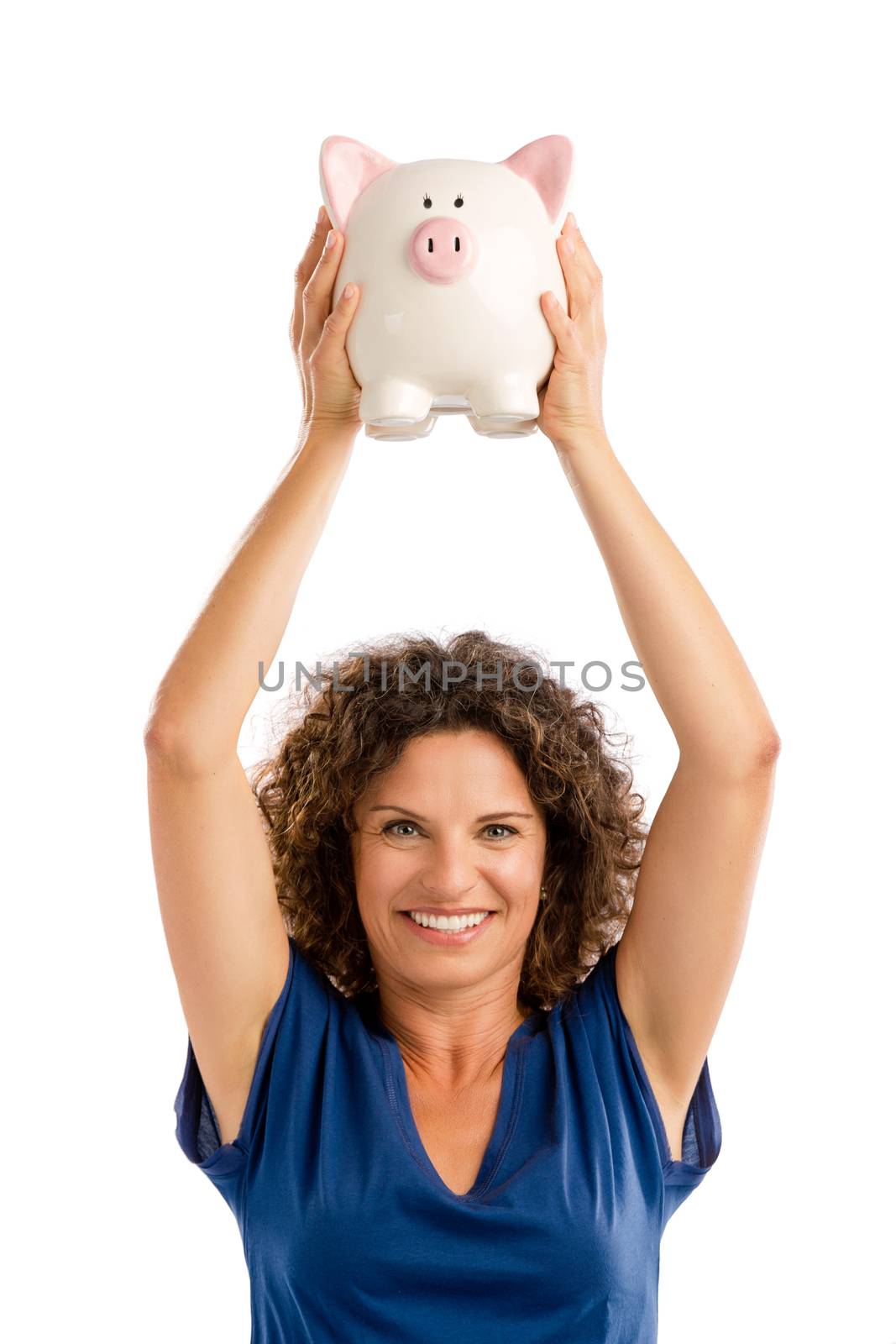 Portrait of a happy middle aged woman holding a Piggybank over her head