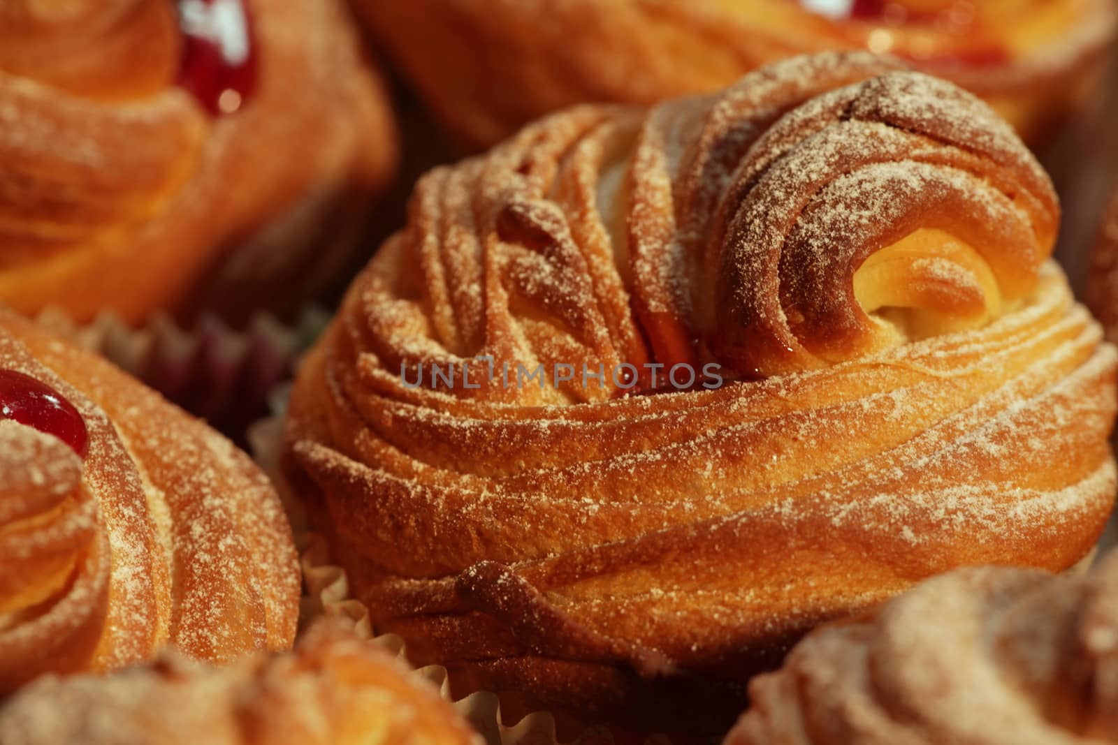 American cruffins with jam, powdered sugar 