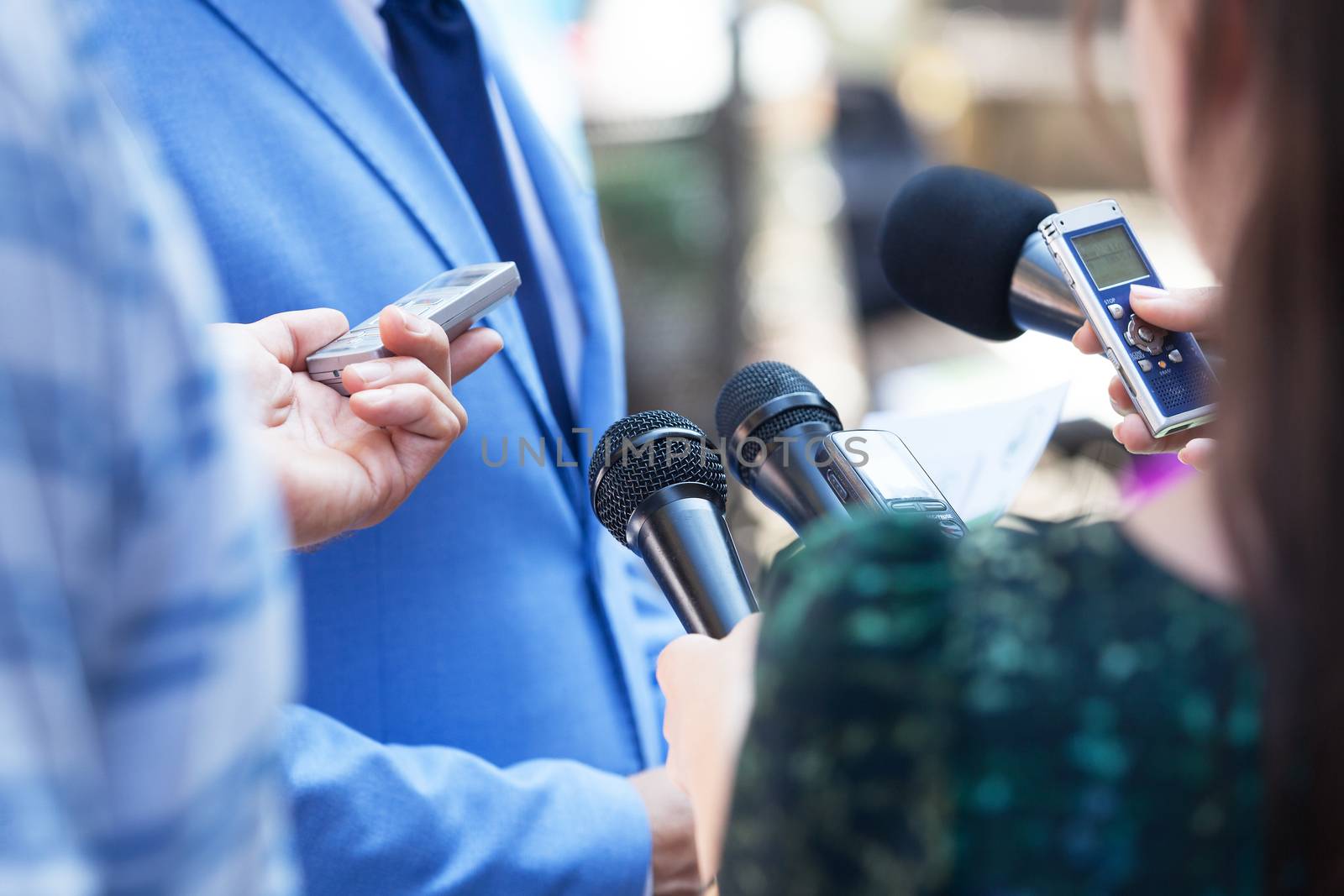 Journalists making media interview with businessperson or politician. Press conference. Journalism.