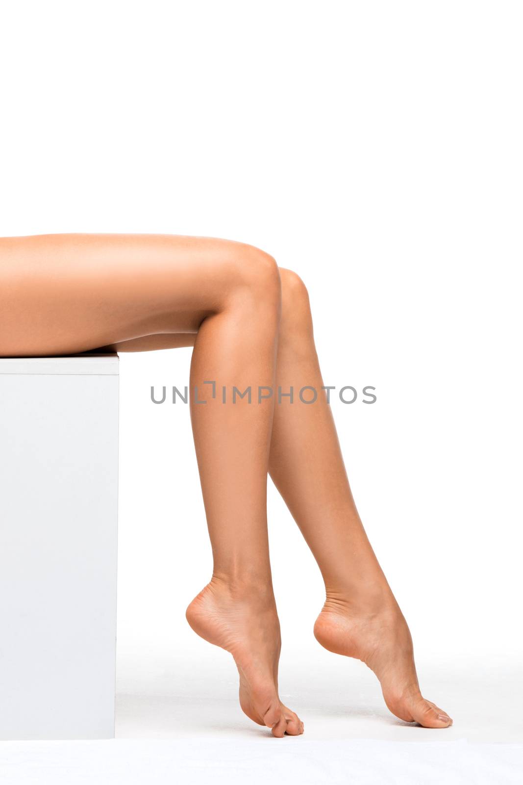 Perfect female legs isolated on white background