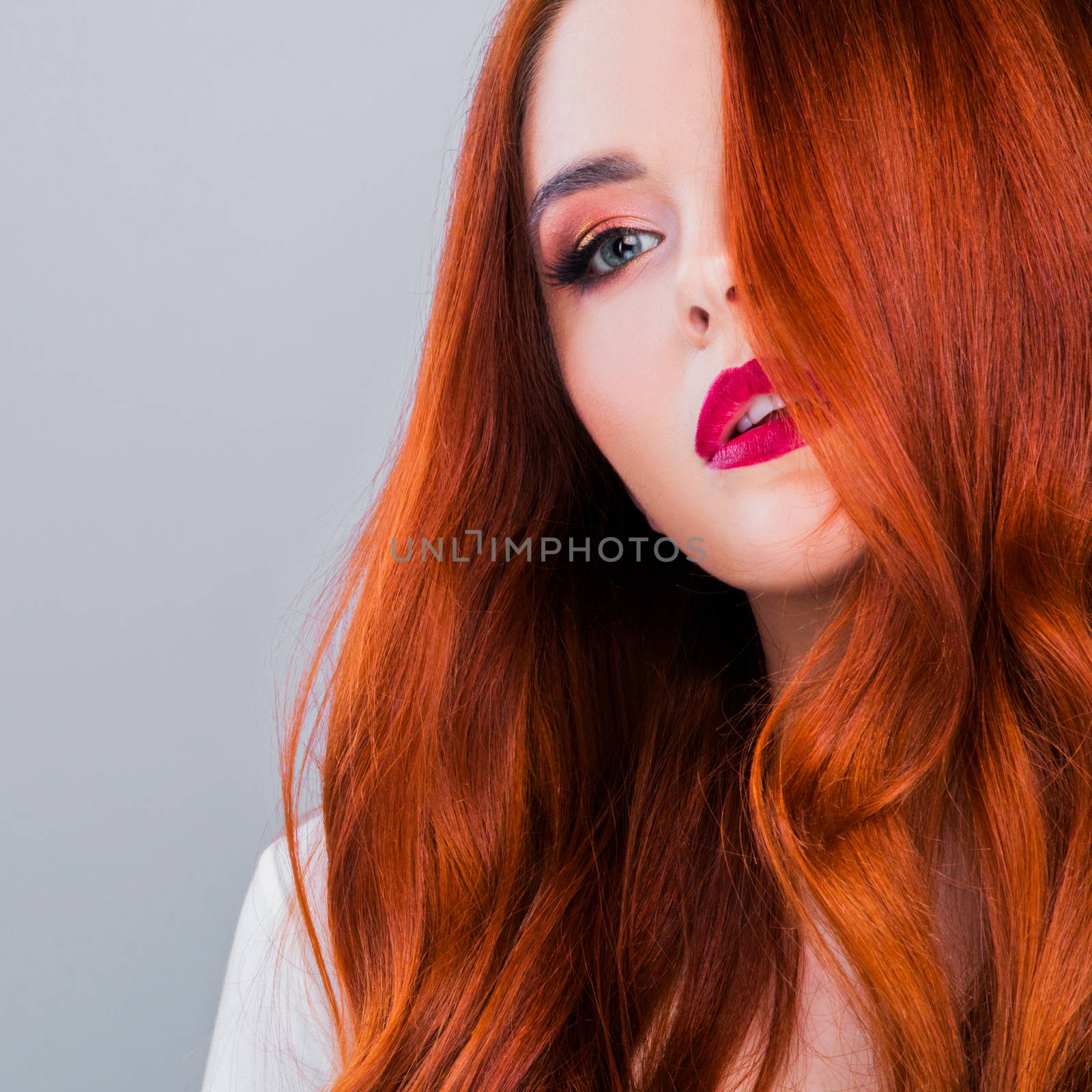 Photoshot of gorgeous redhead girl with bright makeup