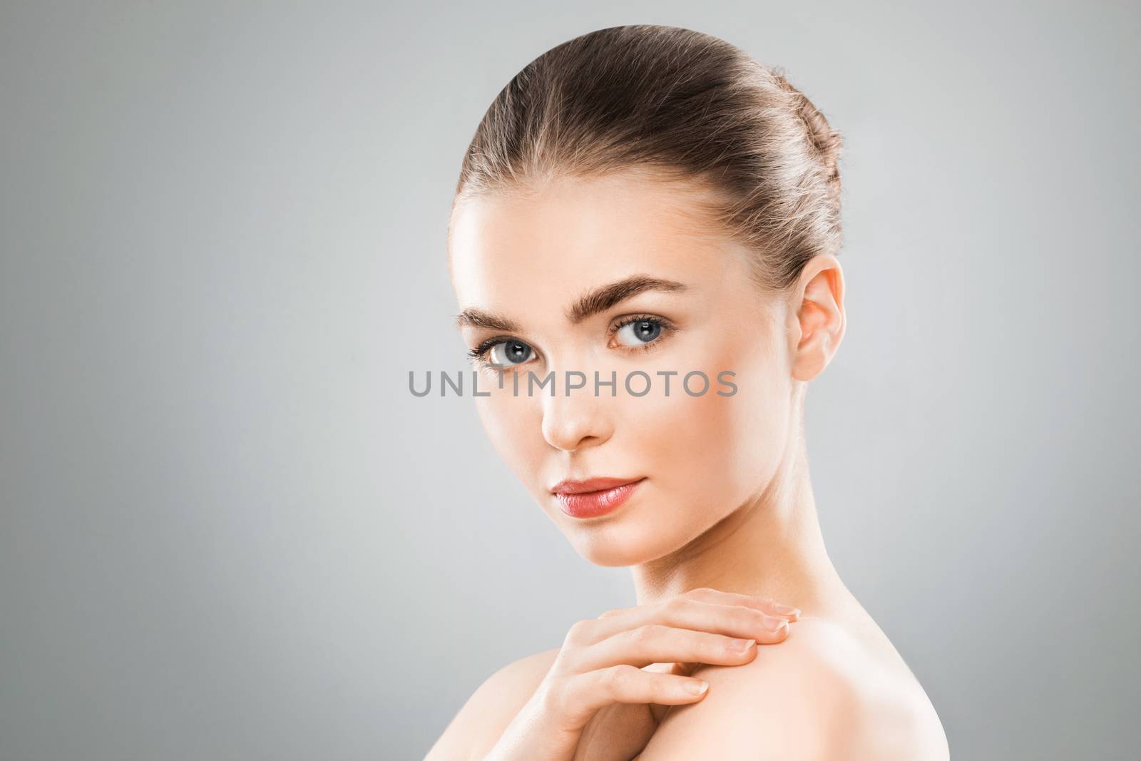 Beauty woman face portrait. Beautiful spa model girl with perfect fresh clean skin. Female looking at camera. Youth and skin care Concept