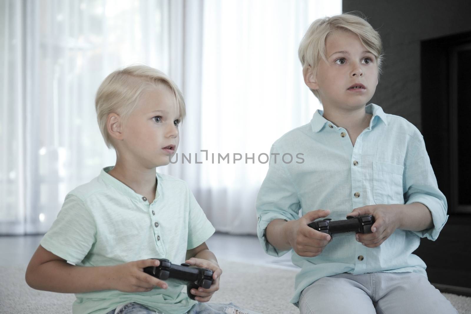 Kids playing video games by ALotOfPeople