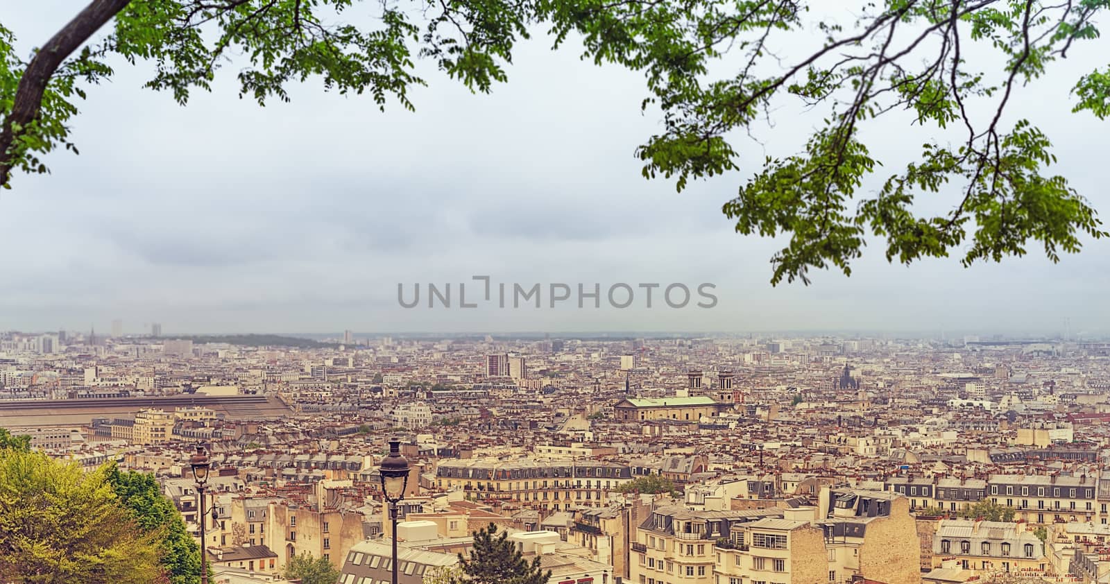 Panoramic distant scene of Paris skyline and urban and industrial areas