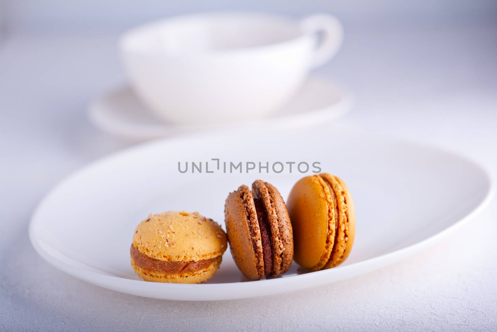 Almond cookies French macaroons on a white surface