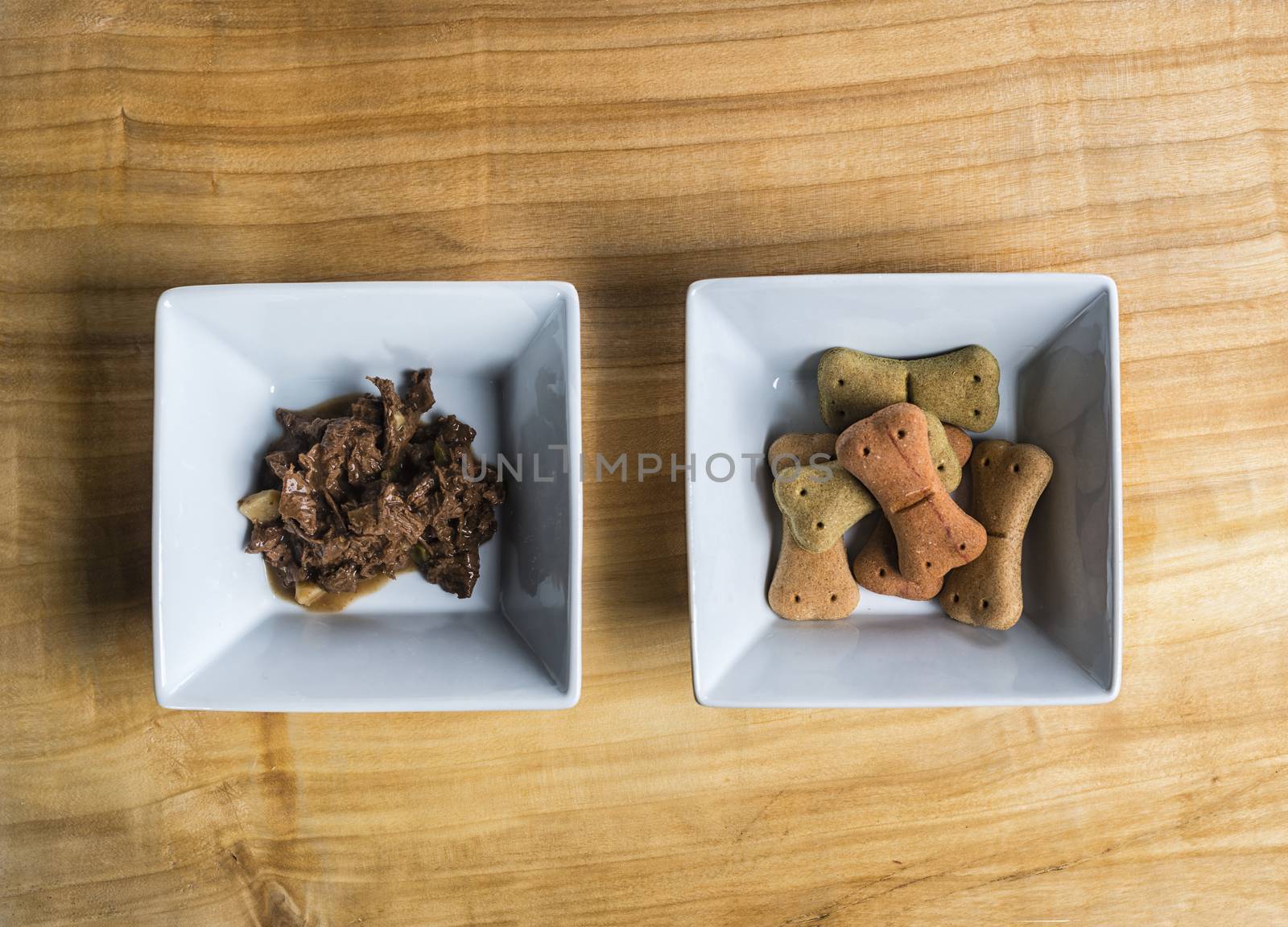 Dog food over a wooden board served very chic way.