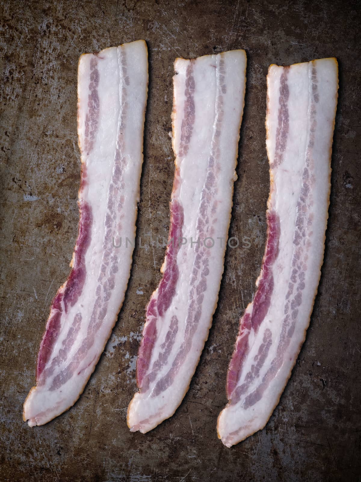 rustic uncooked bacon by zkruger