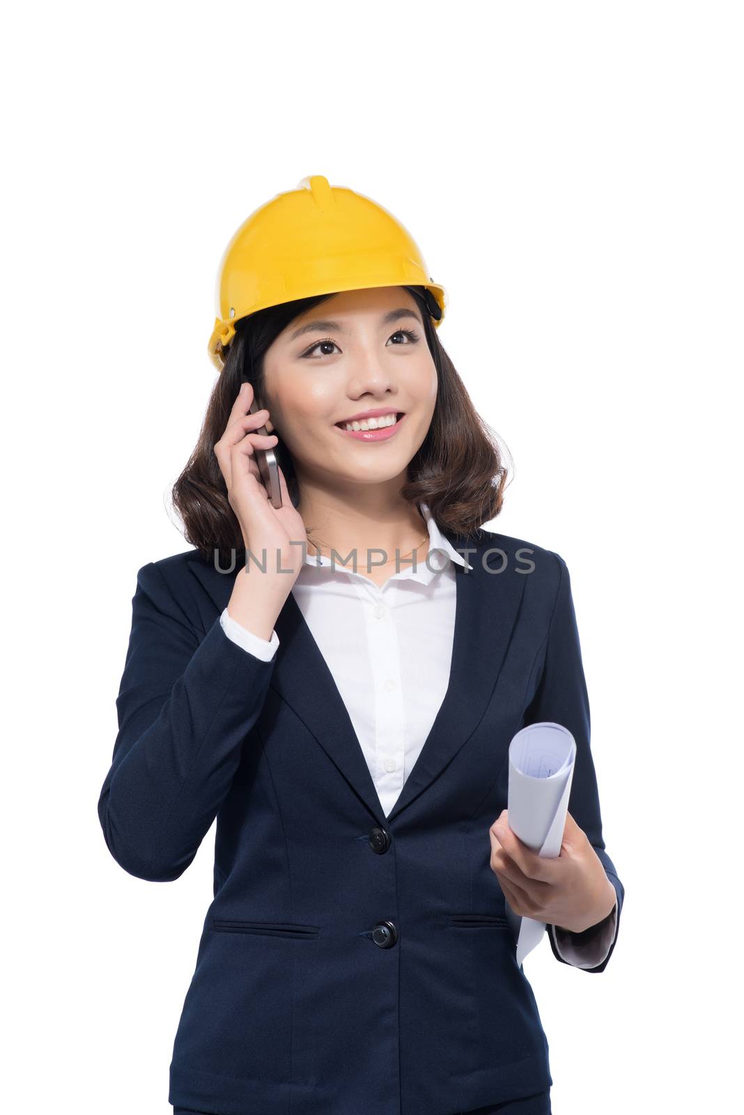 Smiling architect woman using smartphone isolated on white.
