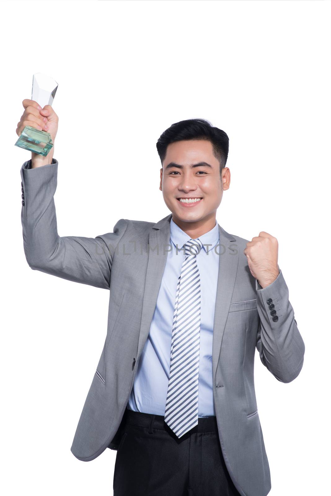 Successful asian businessman holding a trophy on white backgroun by makidotvn