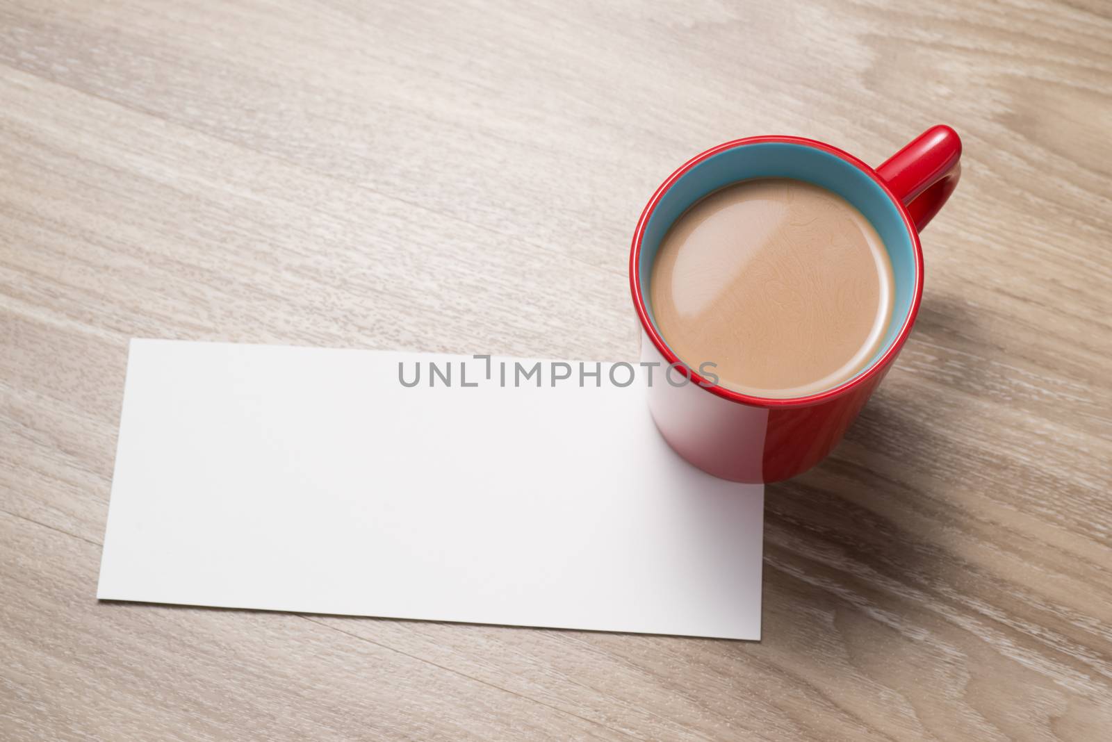 Blank paper and cup of coffee on the desk by makidotvn