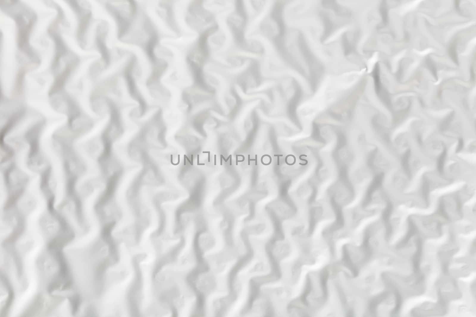 Abstract background texture of white wrinkled paper close-up