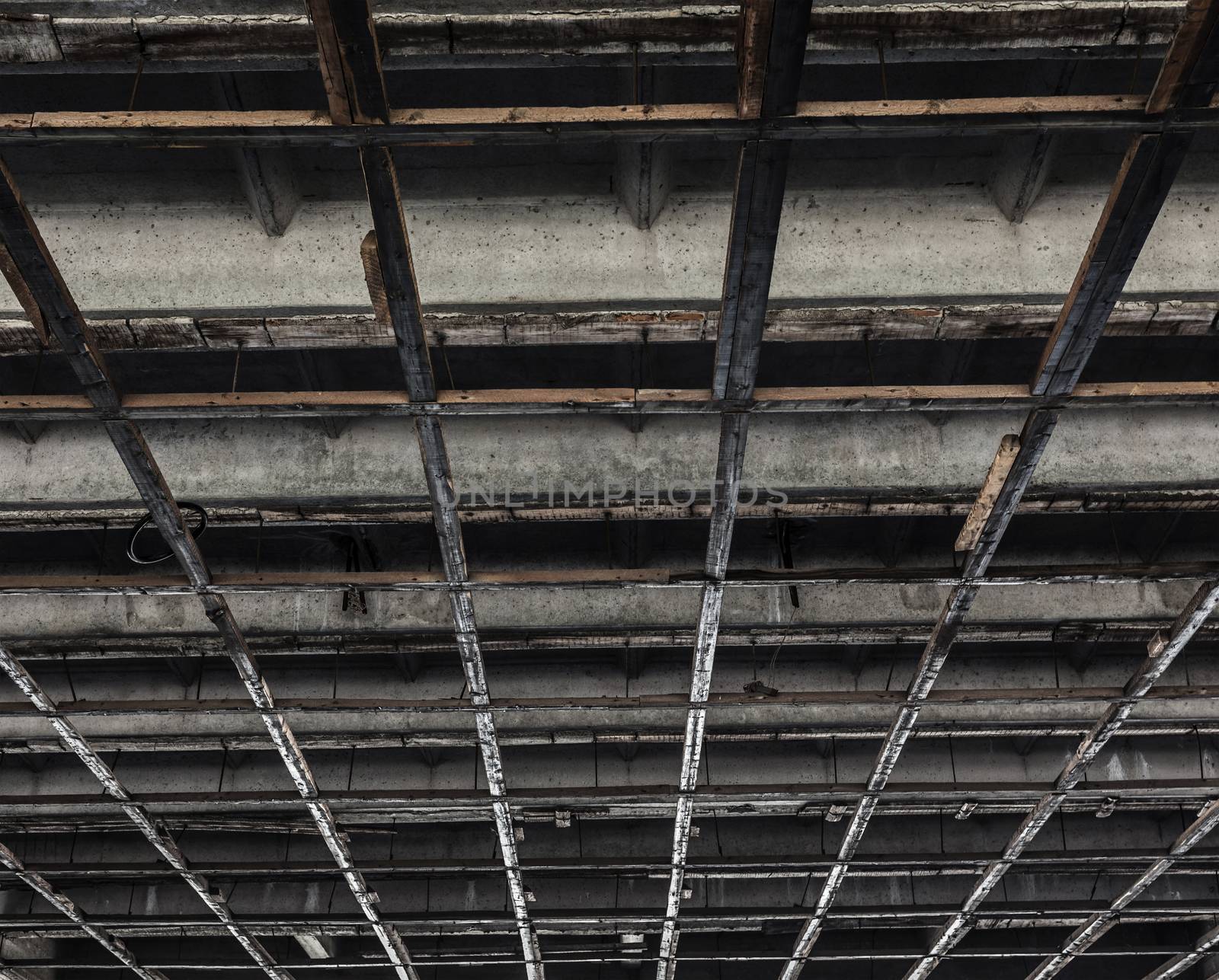 background texture of a concrete ceiling with wooden squares
