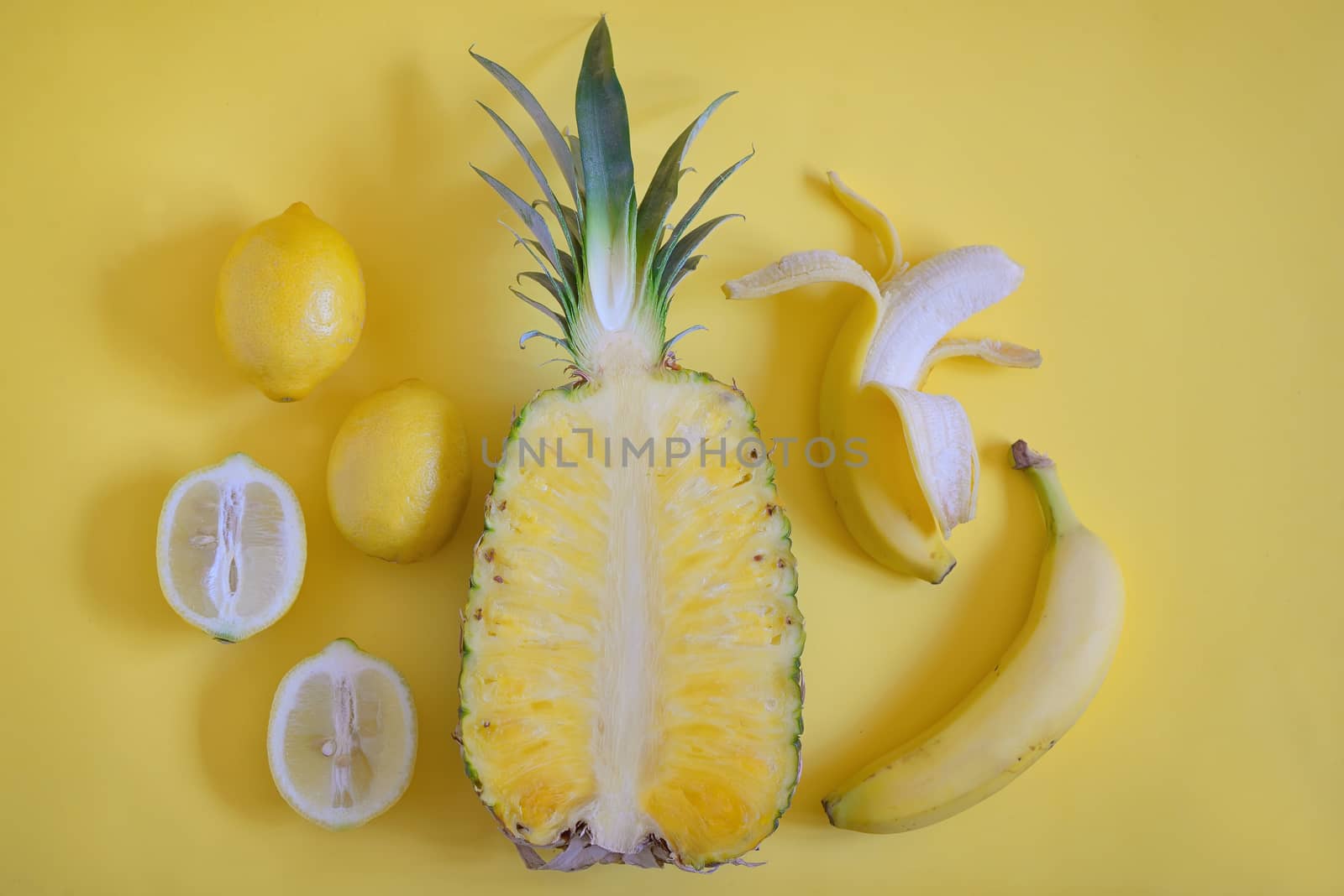 Fruits from above on yellow background