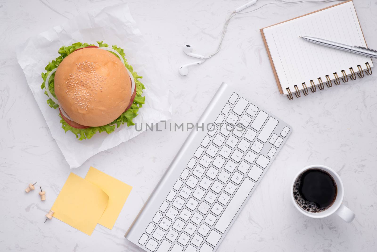 Lunch in office, delicious homemade burger on table.