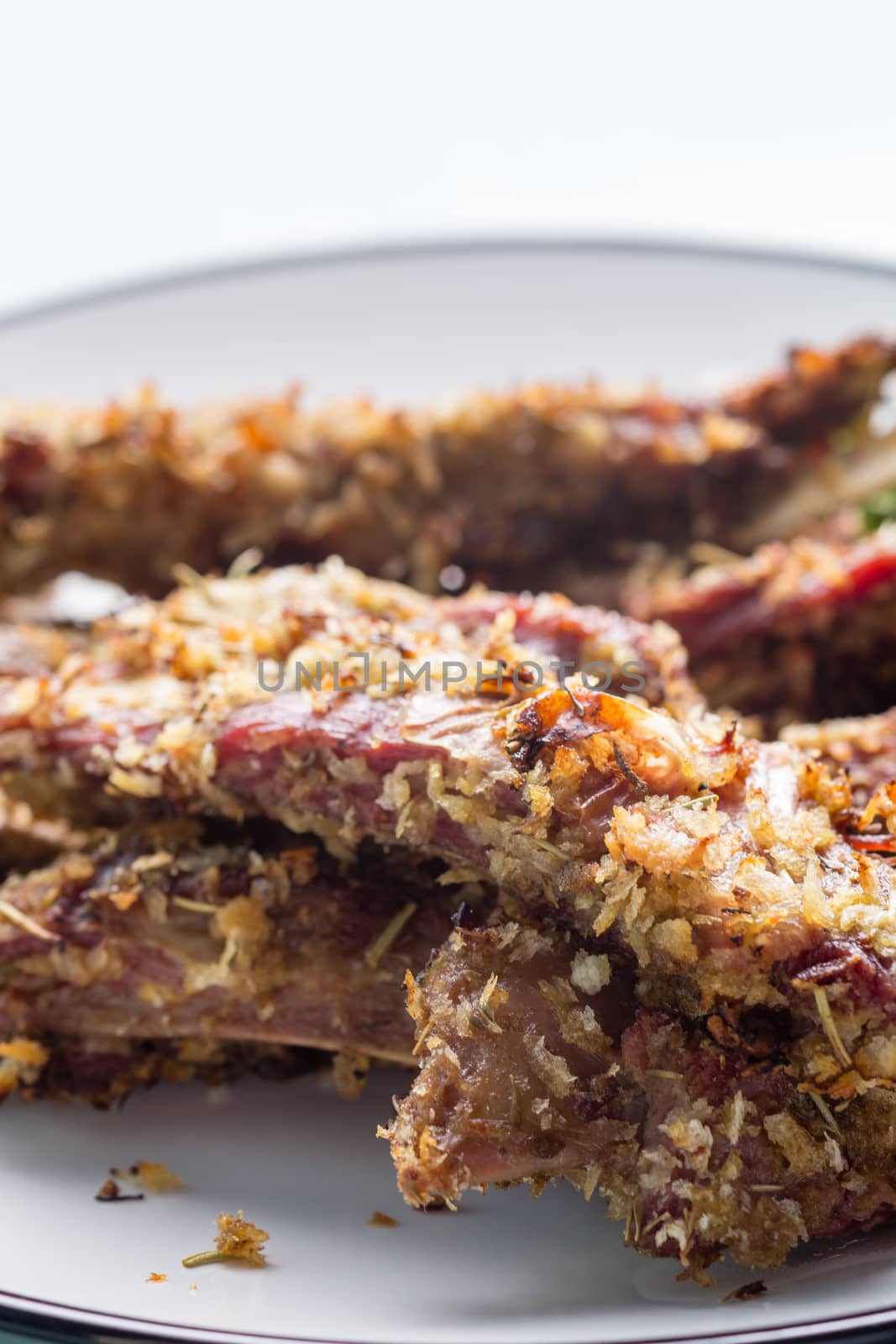 German style lamb chops on white plate