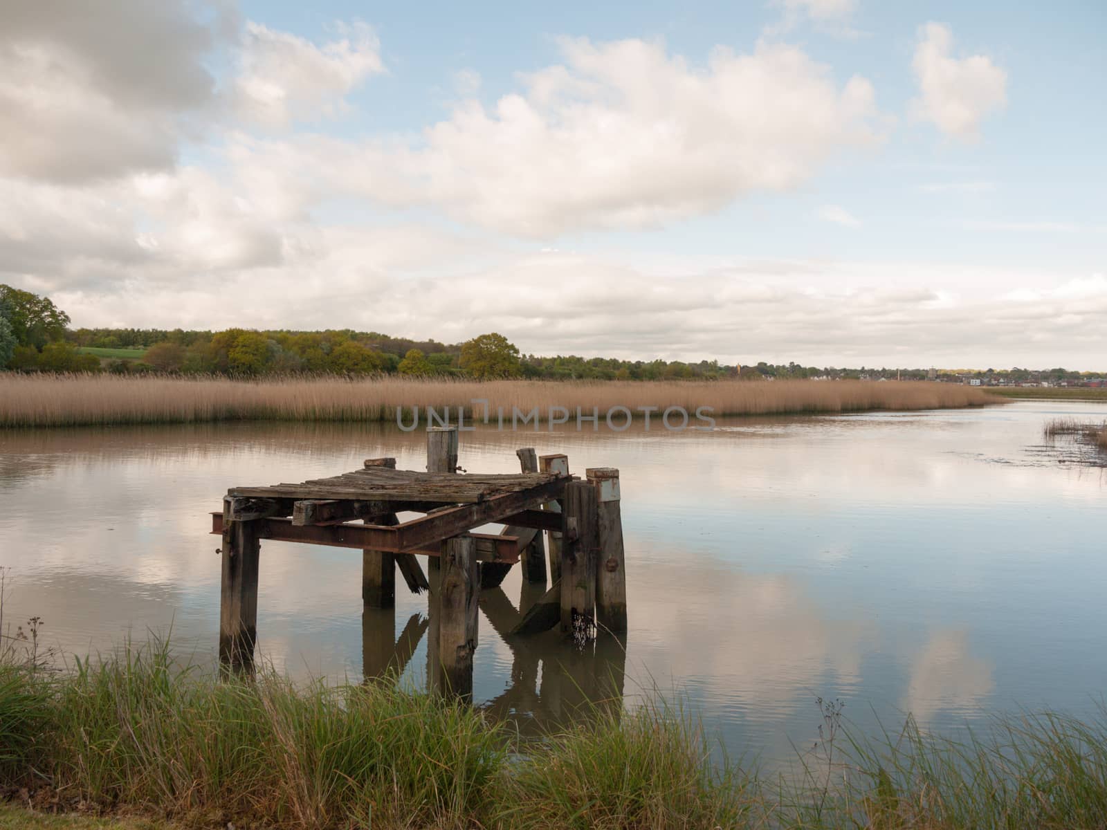 wooden platform in the edge of a lake beautiful by callumrc