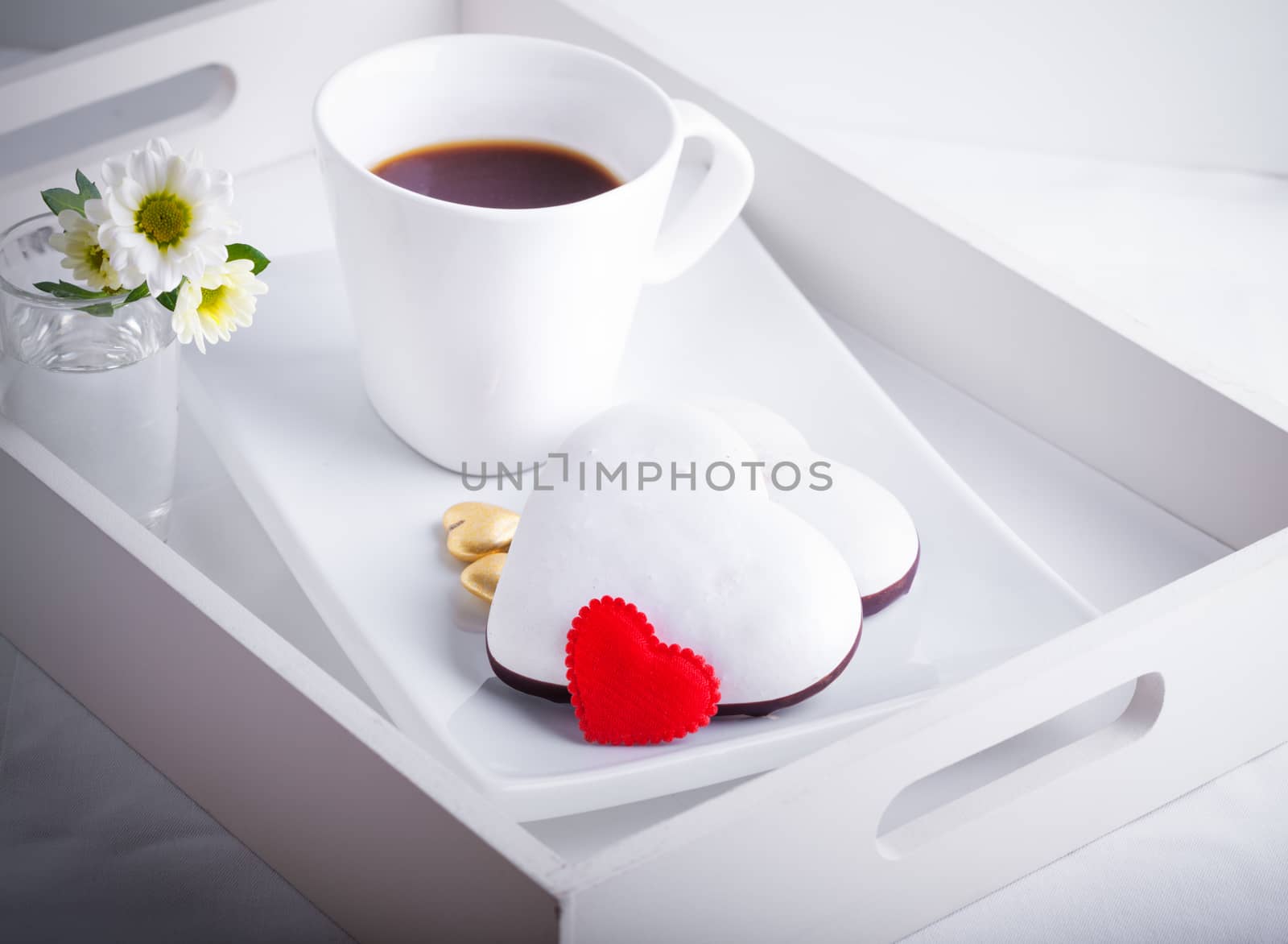 Valentine's Cookies and coffee on a white plate