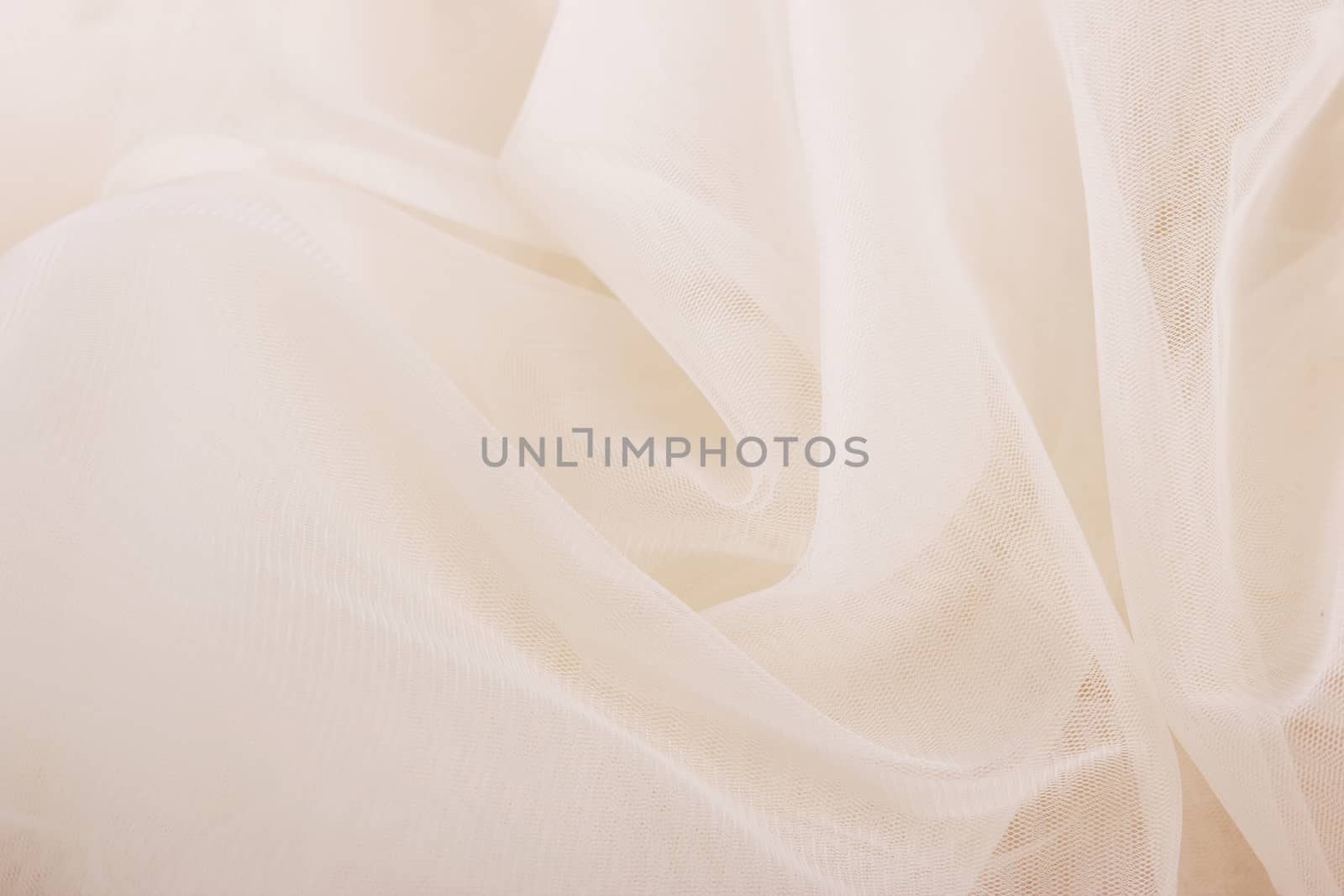 ivory chiffon tulle fabric textured background. pleated skirt fabric texture. closeup plisse fabric texture pattern