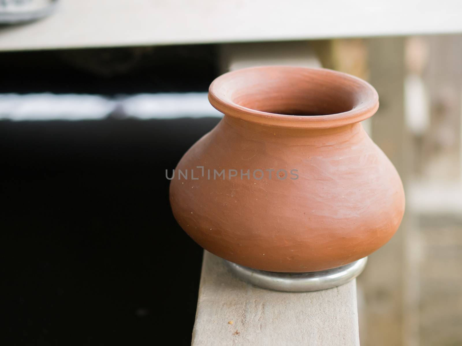 COLOR PHOTO OF WATER POT MADE OF CERAMIC