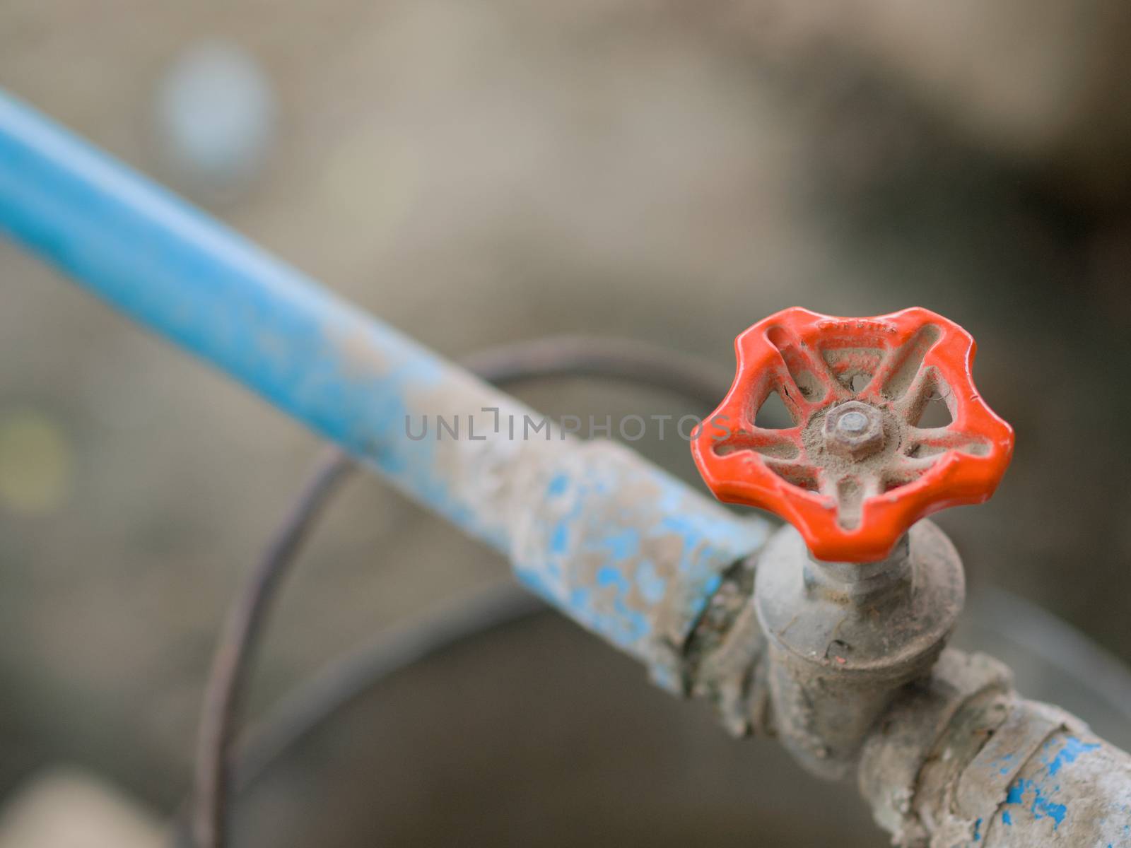 COLOR PHOTO OF CLOSE-UP SHOT OF METAL TAP