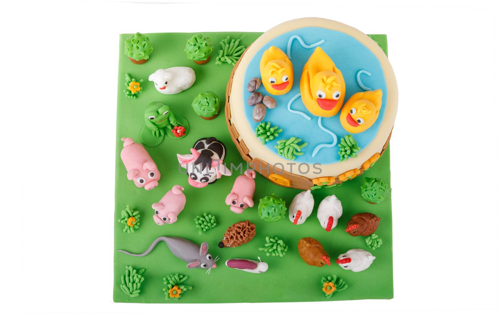 birthday cake with farm marzipan animals and number 3 isolated on white background