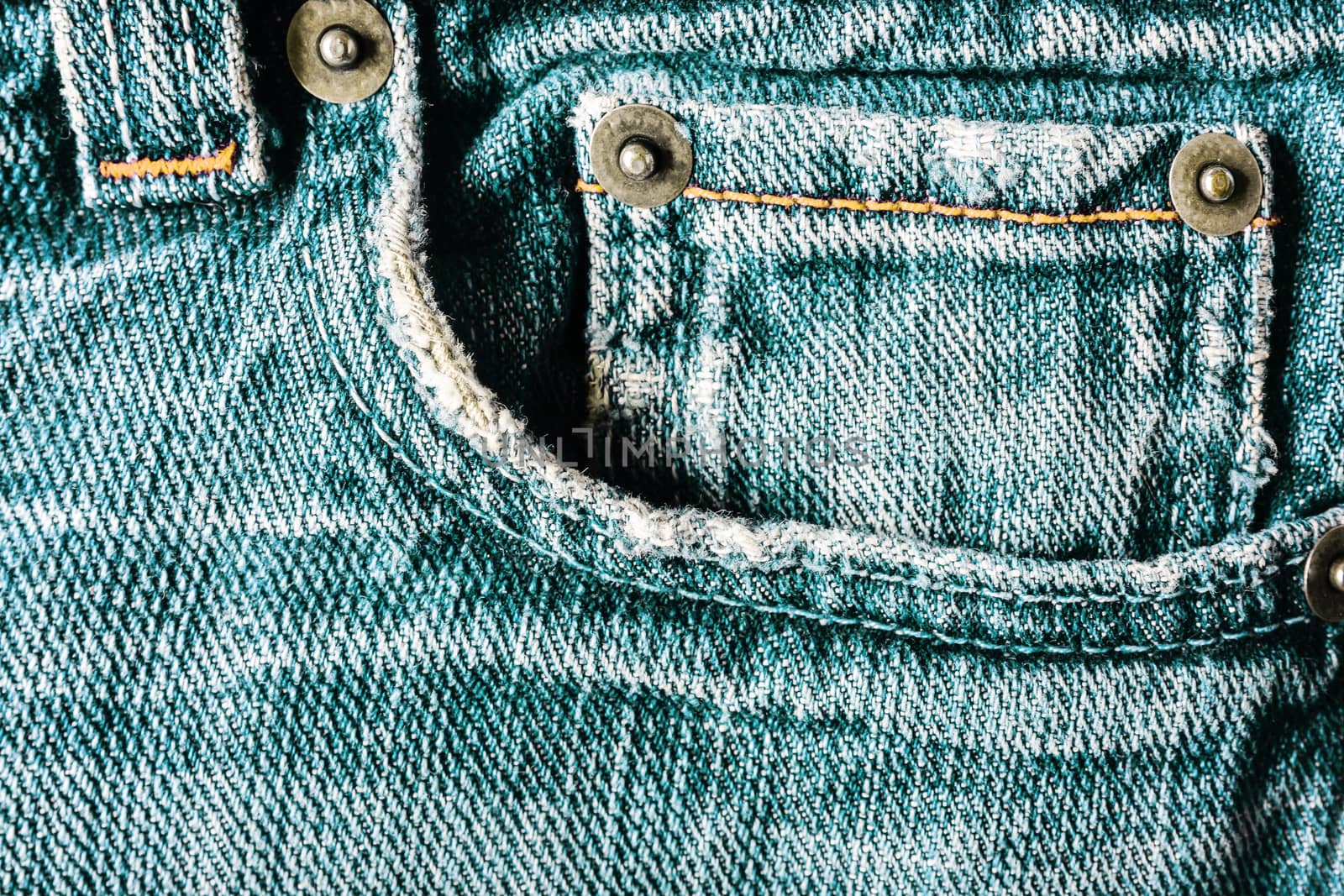 Jeans close-up, old, pocket back, front crumpled ragged
