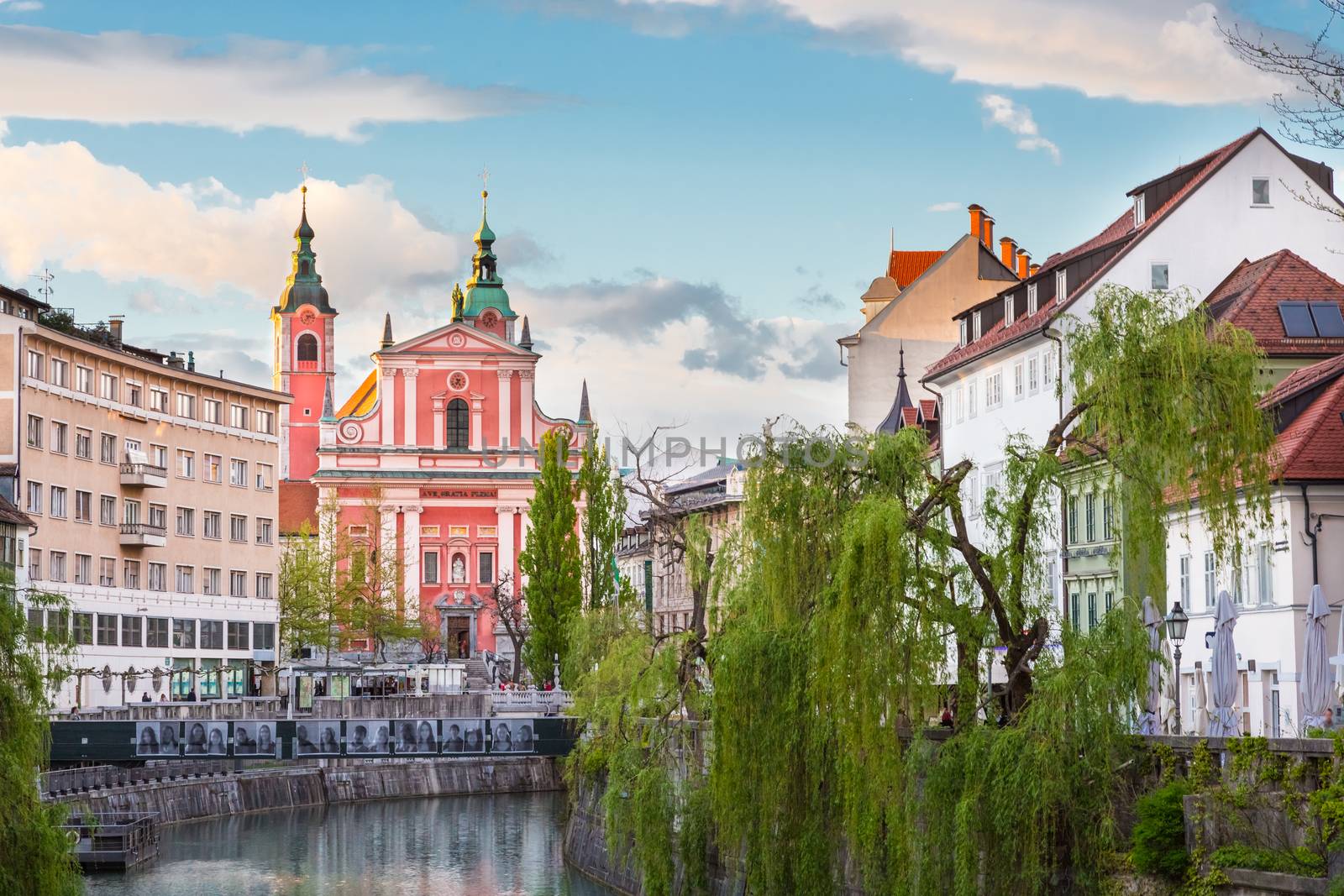 Romantic Ljubljana city center. River Ljubljanica, Triple Bridge - Tromostovje, Preseren square and Franciscan Church of the Annunciation. Ljubljana Slovenia Europe.