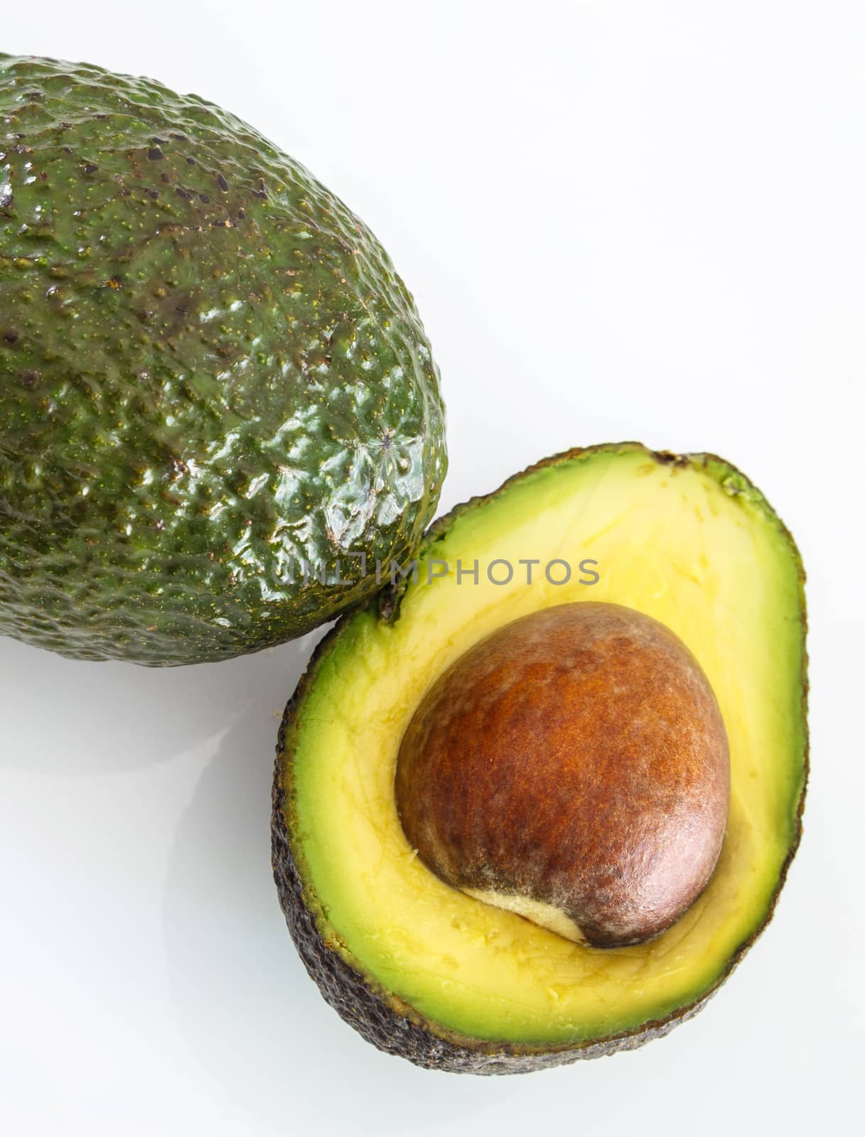 Fresh avocado on white background. Selective focus by pixinoo