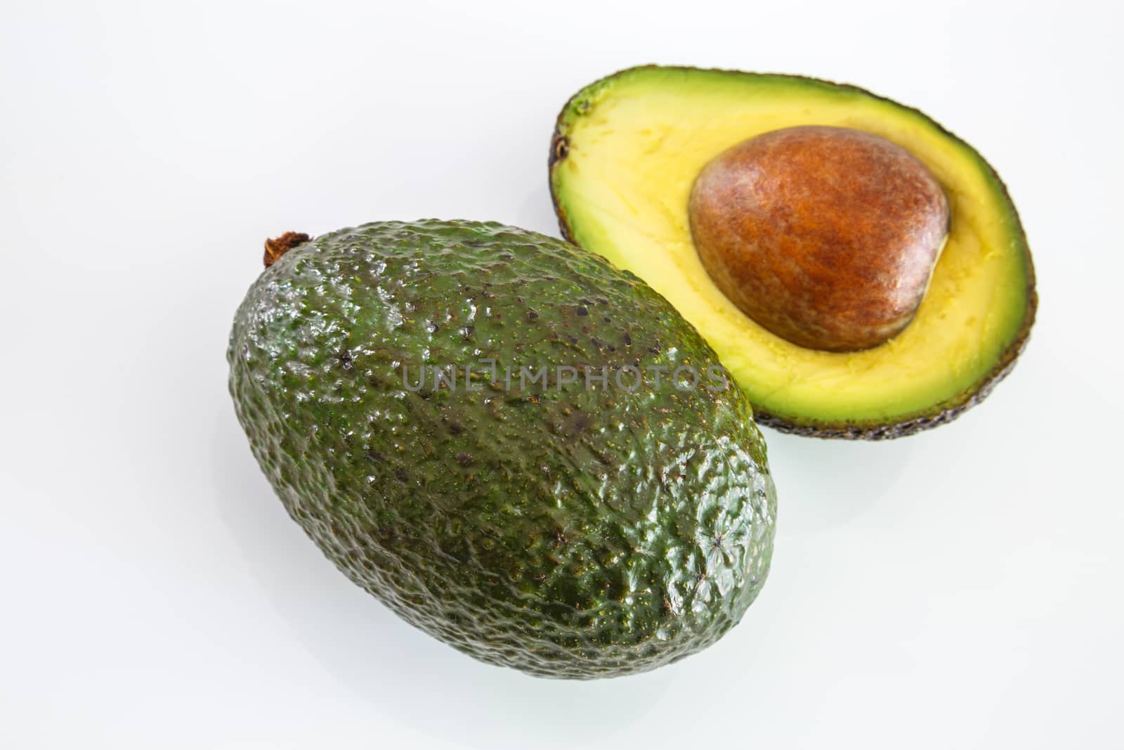 Fresh avocado on white background. Selective focus